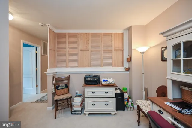 a bedroom with a bed dresser and a window