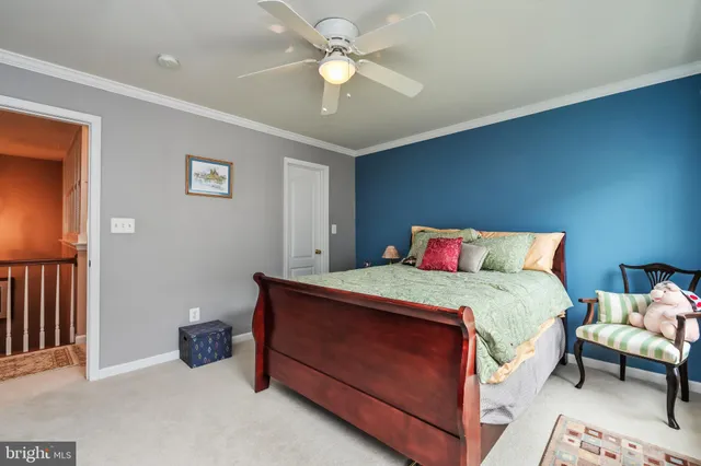 a bed room with furniture and a window