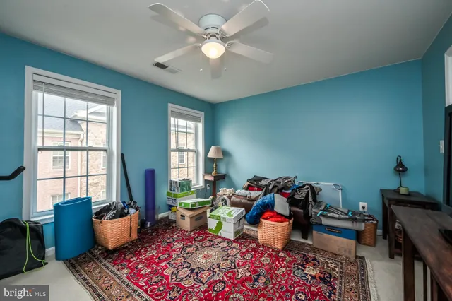 a view of a brick building next to a yard