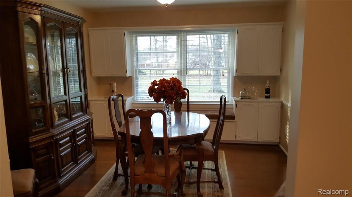 8463 Hampton Road Grosse Ile, MI 48138 - Photo 13 of 37 Dining room with built-in window seat, and cabinets.