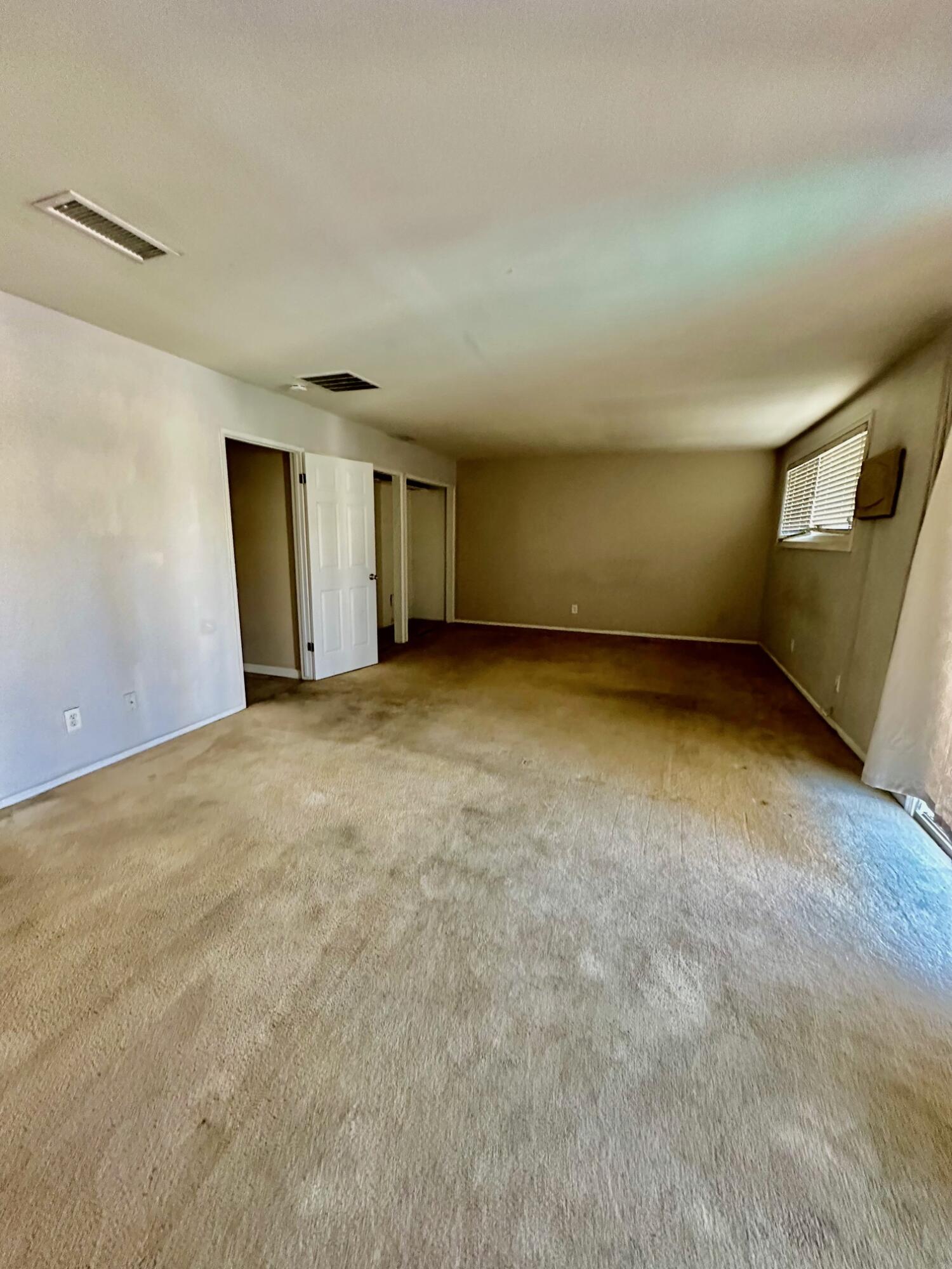 73100 Santa Rosa Way Palm Desert, CA 92260 - Photo 14 of 25 a view of an empty room with a window