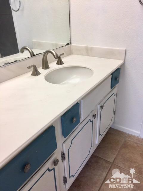 73100 Santa Rosa Way Palm Desert, CA 92260 - Photo 19 of 25 a bathroom with a sink and a mirror