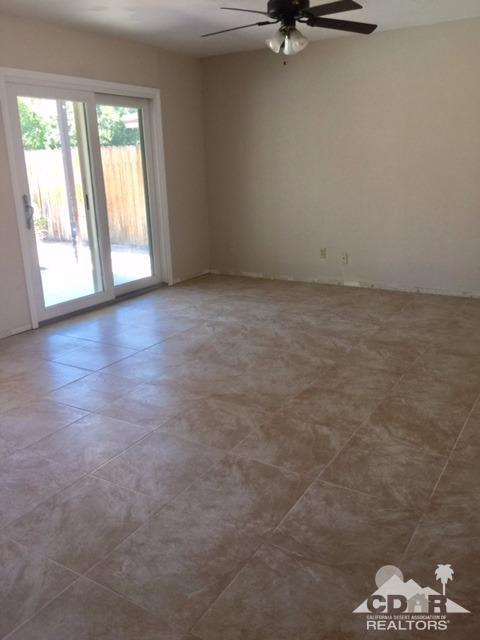 73100 Santa Rosa Way Palm Desert, CA 92260 - Photo 21 of 25 wooden floor and window in an empty room
