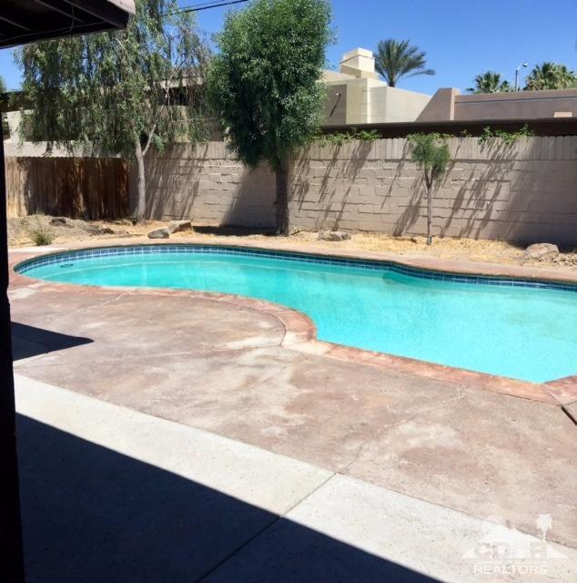 73100 Santa Rosa Way Palm Desert, CA 92260 - Photo 3 of 25 a view of a yard with a bench