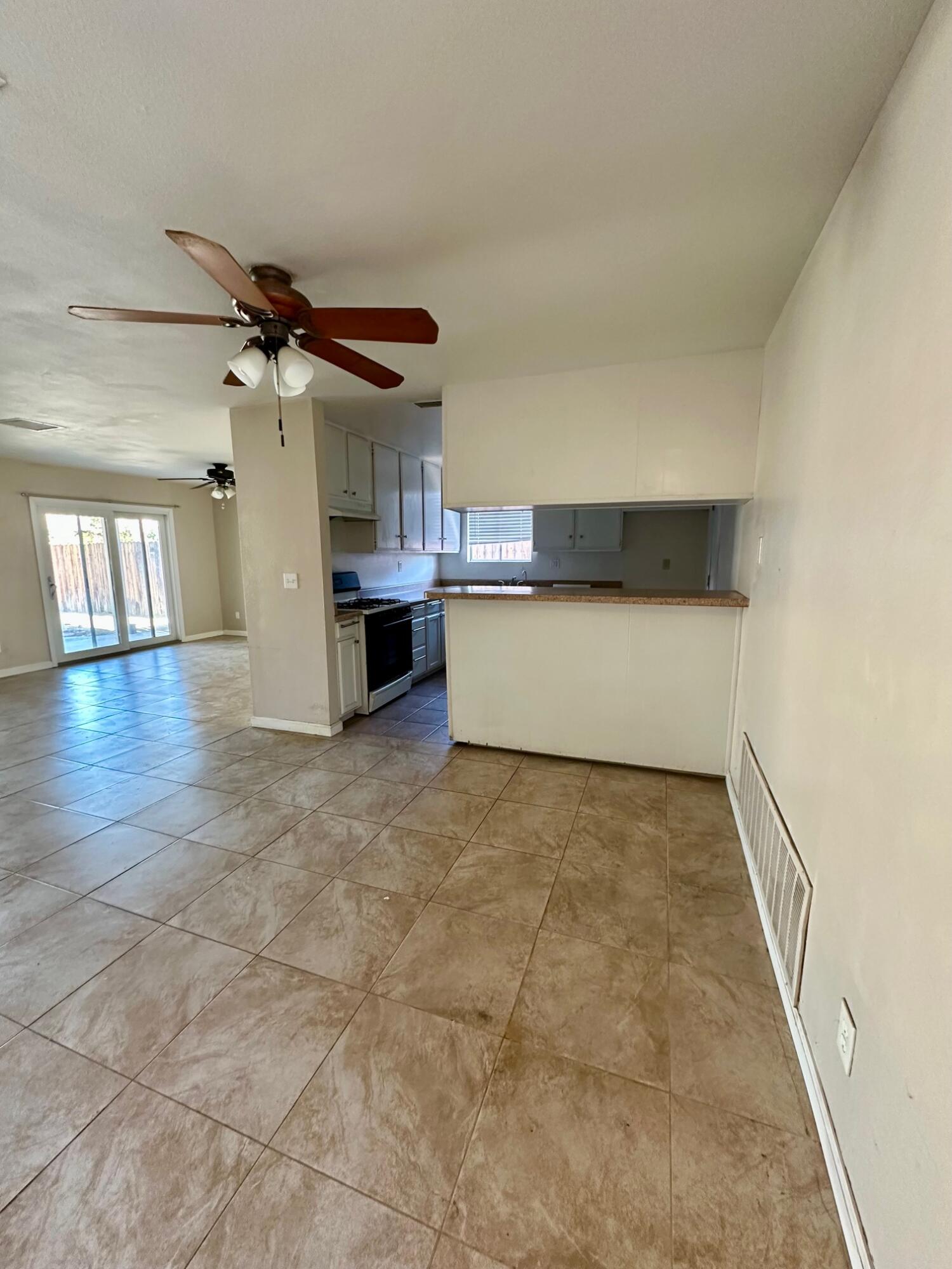 73100 Santa Rosa Way Palm Desert, CA 92260 - Photo 5 of 25 a view of a kitchen with a dishwasher and cabinets