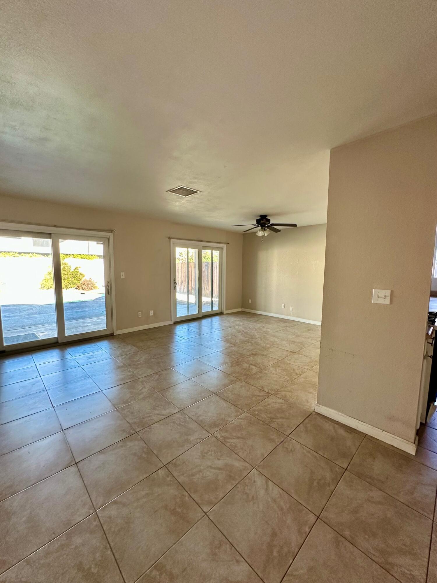 73100 Santa Rosa Way Palm Desert, CA 92260 - Photo 8 of 25 wooden floor in an empty room with a window