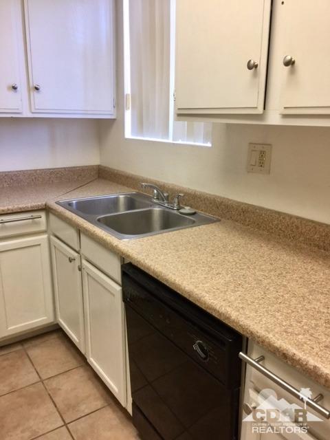 73100 Santa Rosa Way Palm Desert, CA 92260 - Photo 10 of 25 a kitchen with a sink and cabinets