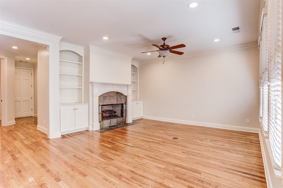 10219 Statfield Drive Collierville, TN 38017 - Photo 13 of 37 wooden floor in an empty room with a fireplace