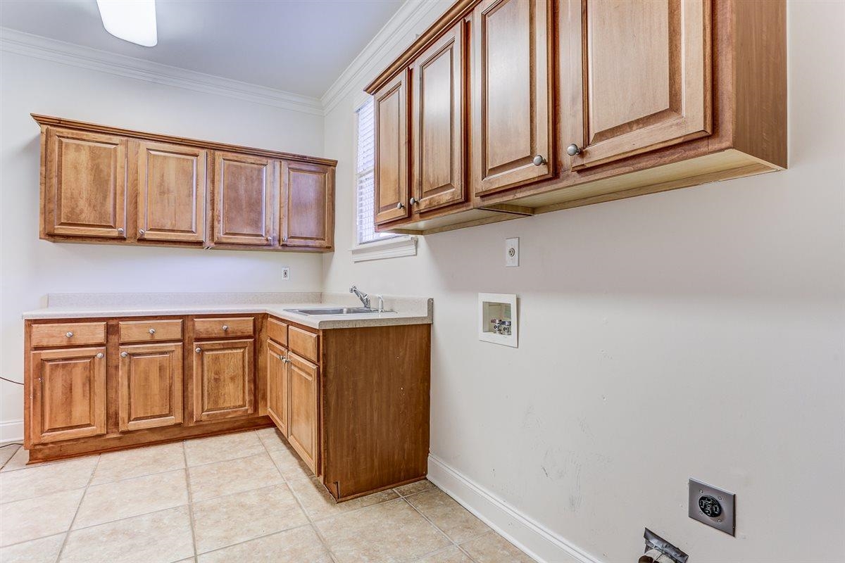 10219 Statfield Drive Collierville, TN 38017 - Photo 14 of 37 a kitchen with stainless steel appliances granite countertop a sink dishwasher stove and cabinets