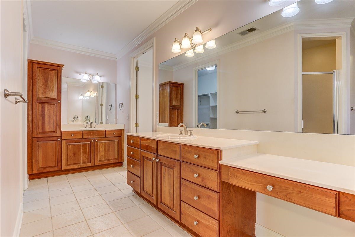 10219 Statfield Drive Collierville, TN 38017 - Photo 18 of 37 a spacious bathroom with a granite countertop double vanity sink a mirror and a shower