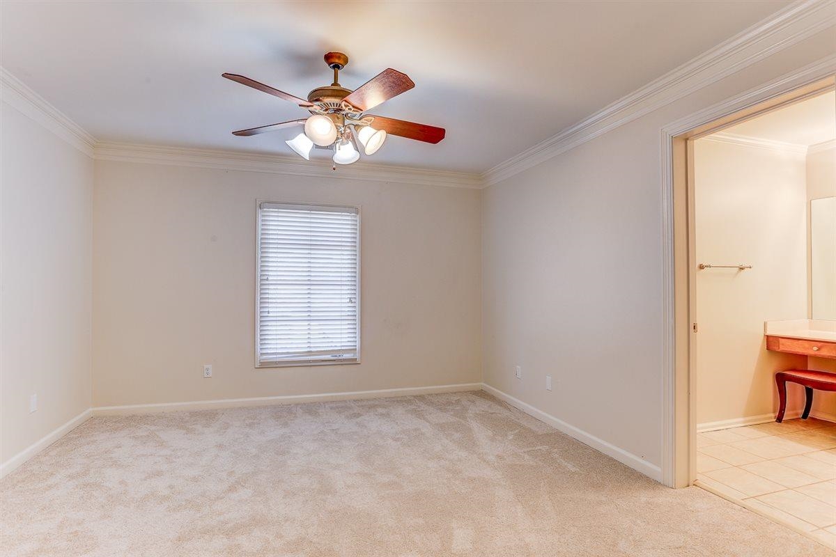 10219 Statfield Drive Collierville, TN 38017 - Photo 24 of 37 a view of a chandelier fan and a window in a room