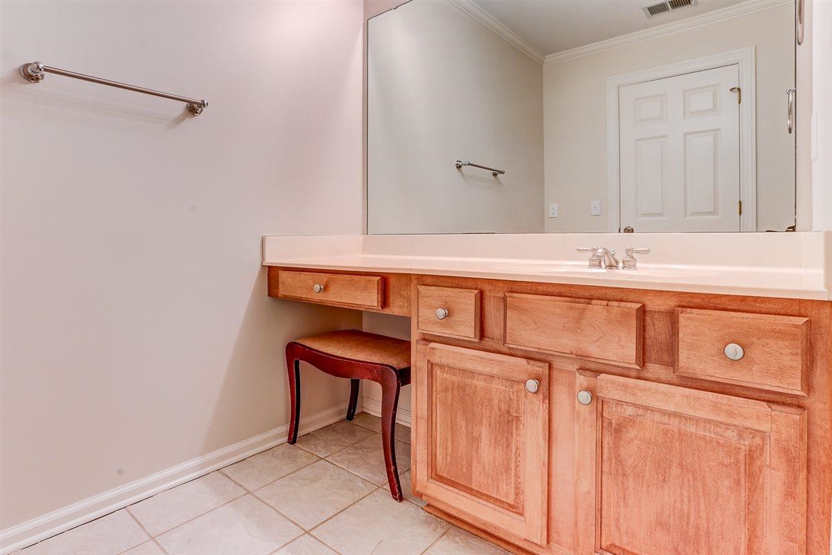 10219 Statfield Drive Collierville, TN 38017 - Photo 25 of 37 a bathroom with a sink and a mirror