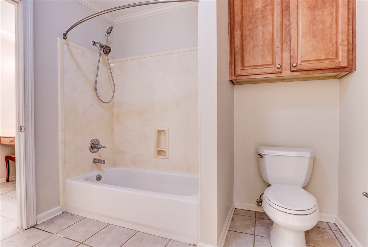 10219 Statfield Drive Collierville, TN 38017 - Photo 28 of 37 a bathroom with a toilet and a shower