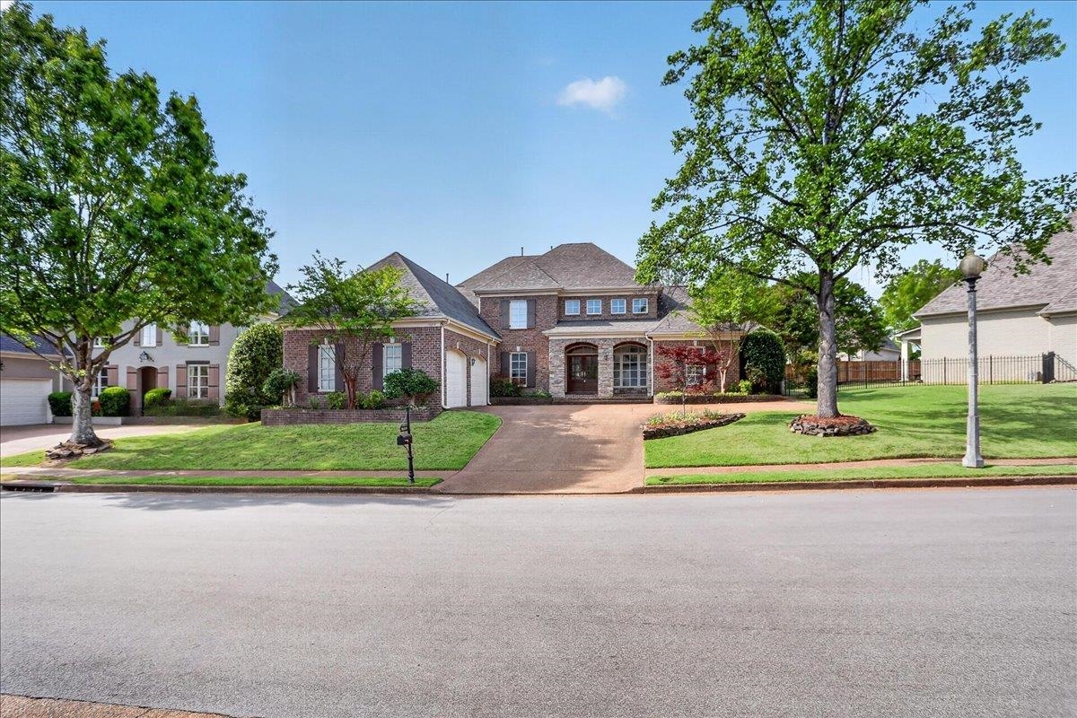 10219 Statfield Drive Collierville, TN 38017 - Photo 34 of 37 a front view of house with yard and green space