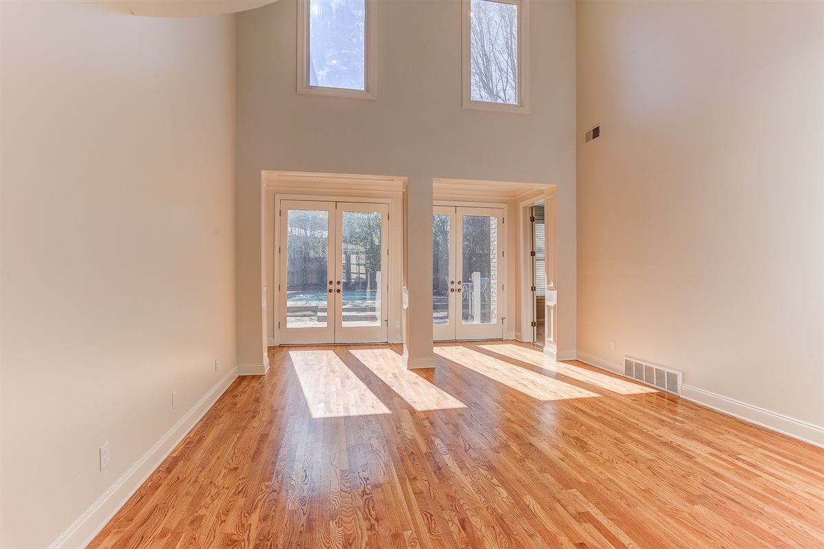 10219 Statfield Drive Collierville, TN 38017 - Photo 4 of 37 a view of an empty room with wooden floor and a window