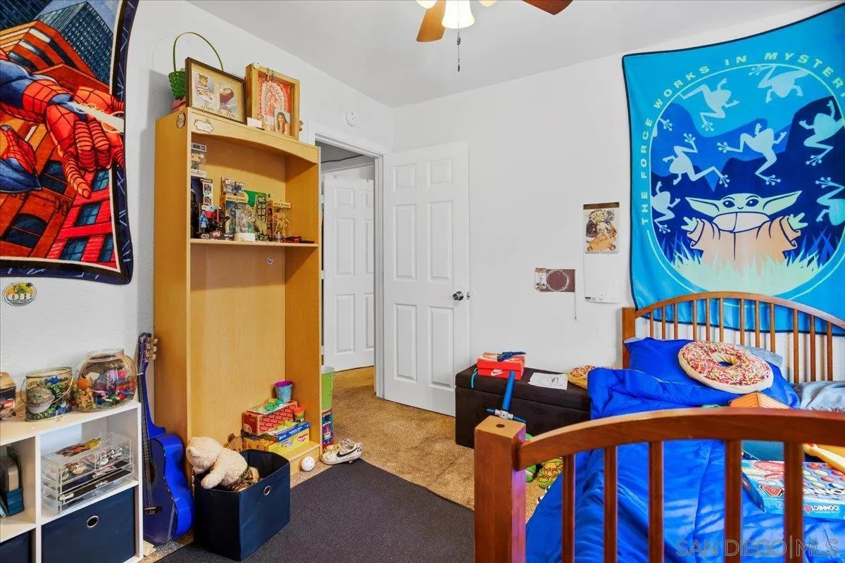 8719 Gardena Road Lakeside, CA 92040 - Photo 20 of 38 a bedroom with furniture and wooden floor