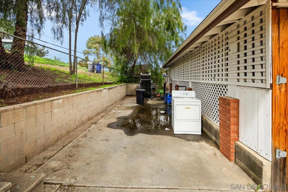 8719 Gardena Road Lakeside, CA 92040 - Photo 25 of 38 a view of a house with a yard