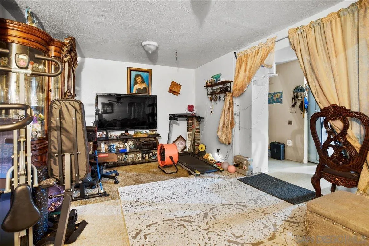 8719 Gardena Road Lakeside, CA 92040 - Photo 27 of 38 a view of a livingroom with furniture and a flat screen tv