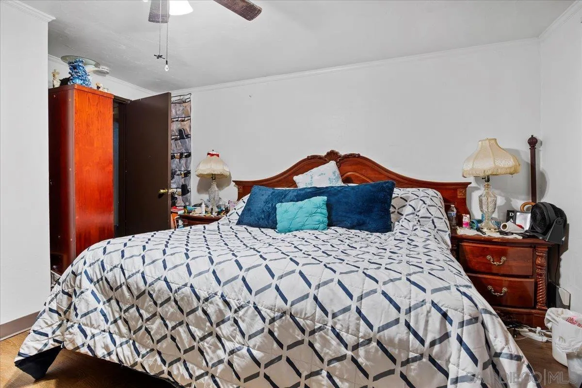 8719 Gardena Road Lakeside, CA 92040 - Photo 29 of 38 a bedroom with a bed and dresser