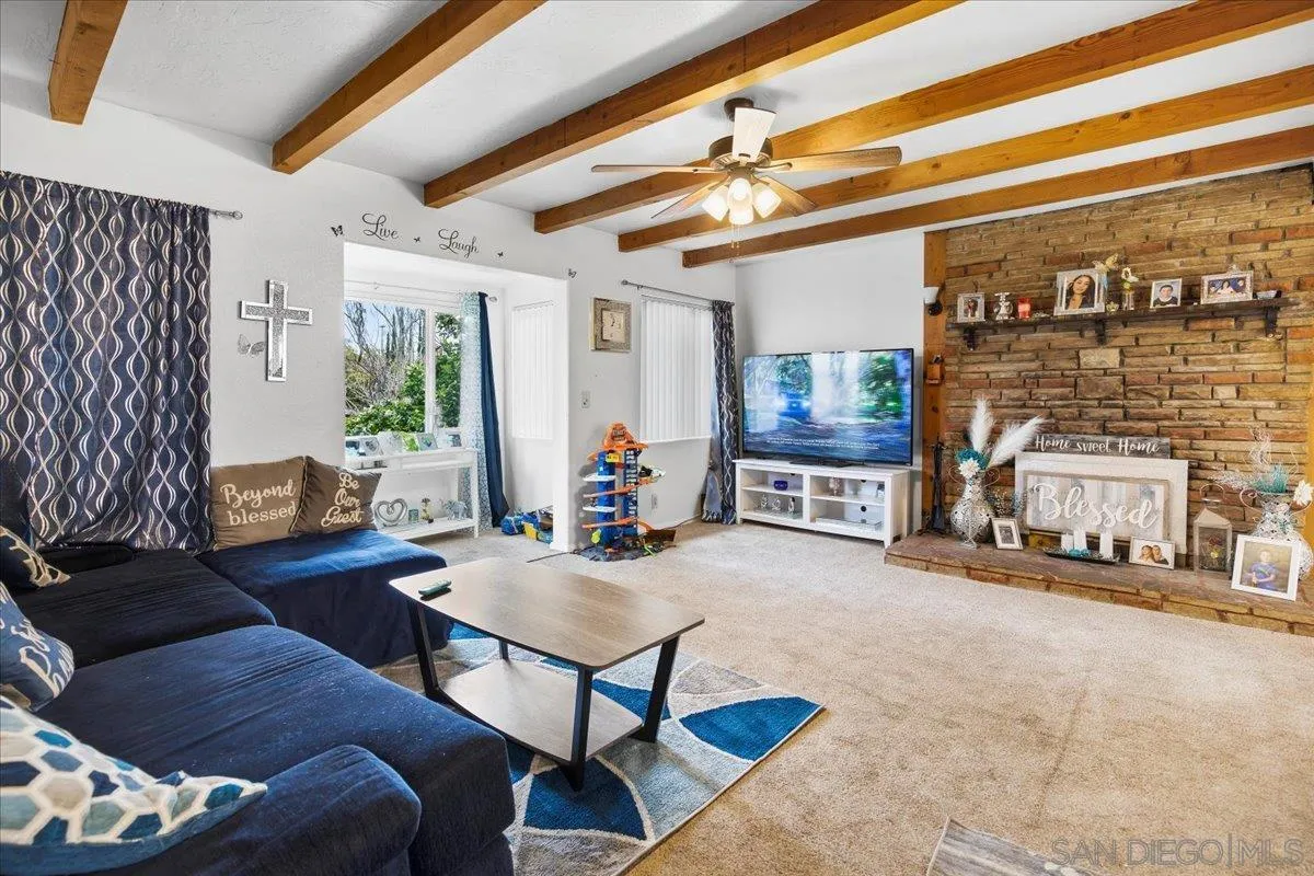 8719 Gardena Road Lakeside, CA 92040 - Photo 3 of 38 a living room with furniture and a floor to ceiling window
