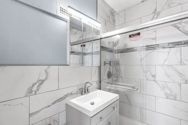a bathroom with a sink and vanity