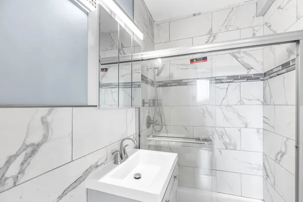 a bathroom with a sink and a shower