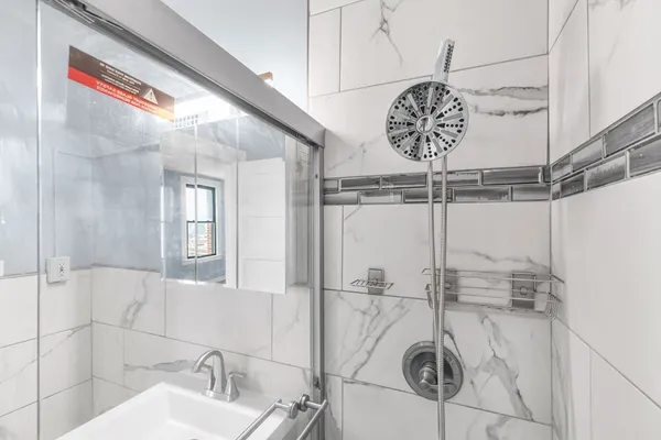 a bathroom with a sink and mirror