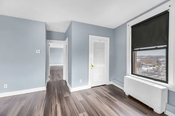 a view of hallway with wooden floor