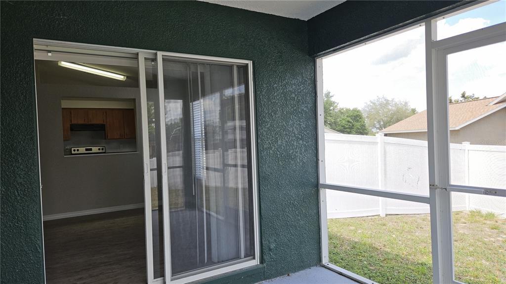 108 Brittany Road Mascotte, FL 34753 - Photo 13 of 17 a view of a glass door with a balcony from a room