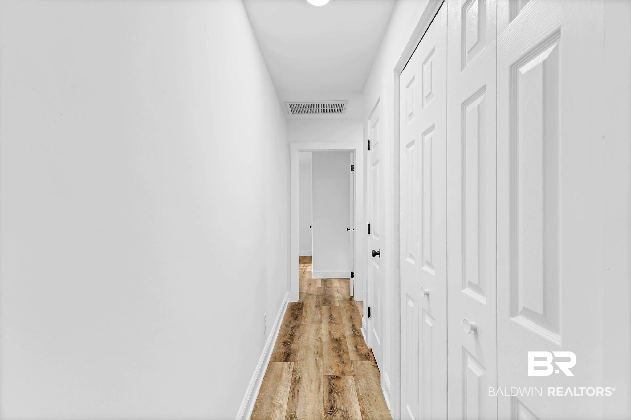 4705 Sherry Court Mobile, AL 36693 - Photo 46 of 100 Hall with baseboards and light wood-style flooring