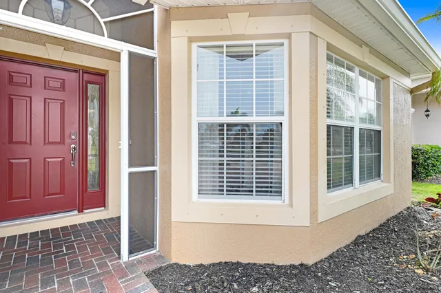 a front view of a house with a large window