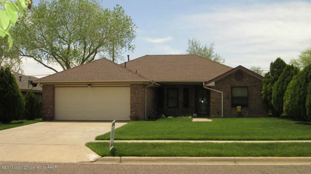 4211 Relatta Avenue Amarillo, TX 79110 - Photo 1 of 41 a front view of a house with a garden and a tree