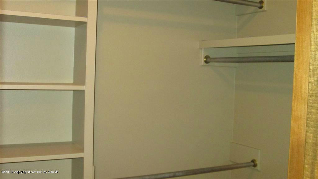 4211 Relatta Avenue Amarillo, TX 79110 - Photo 18 of 41 a bathroom with a glass shower door