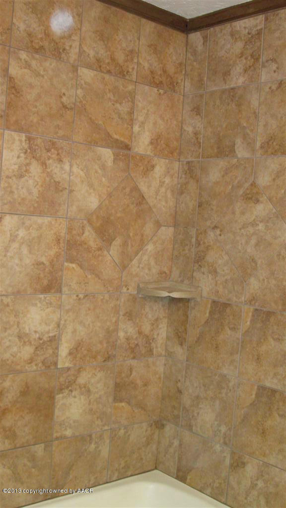 4211 Relatta Avenue Amarillo, TX 79110 - Photo 20 of 41 a bathroom with a shower