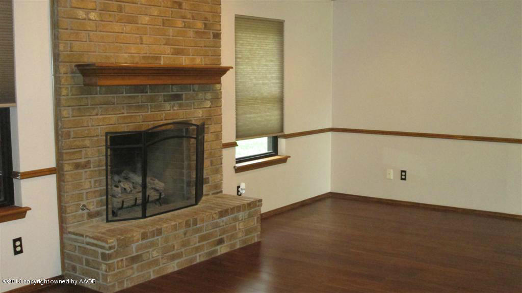 4211 Relatta Avenue Amarillo, TX 79110 - Photo 2 of 41 a view of an empty room and wooden floor
