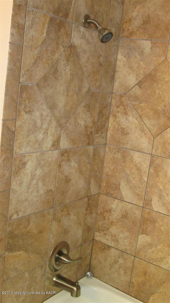4211 Relatta Avenue Amarillo, TX 79110 - Photo 21 of 41 a bathroom with a shower