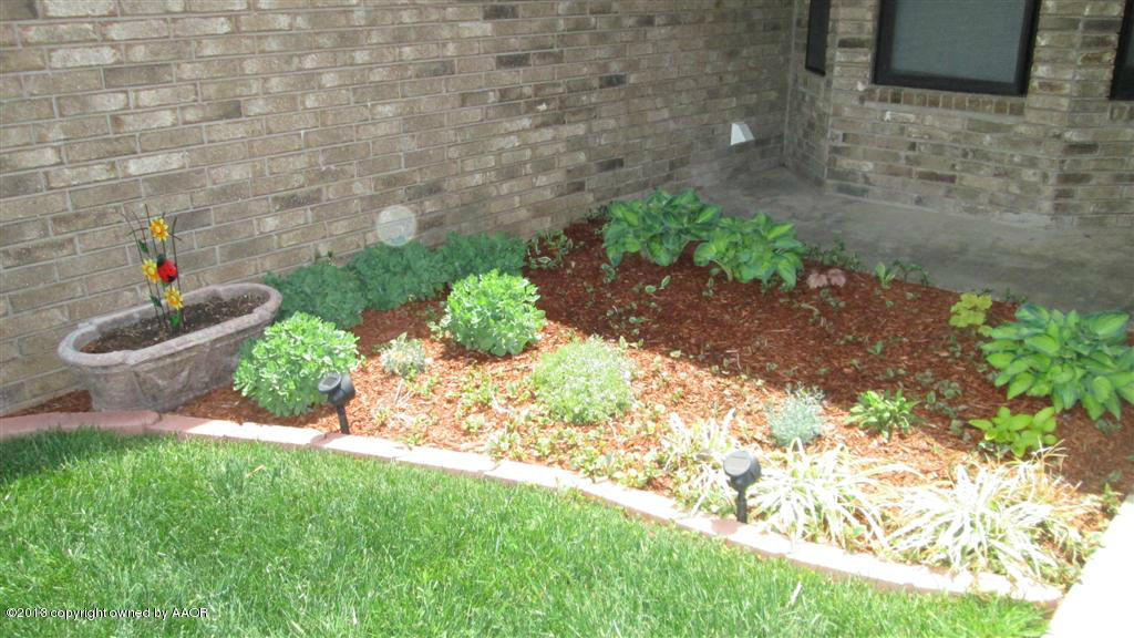 4211 Relatta Avenue Amarillo, TX 79110 - Photo 29 of 41 a front view of a house with garden