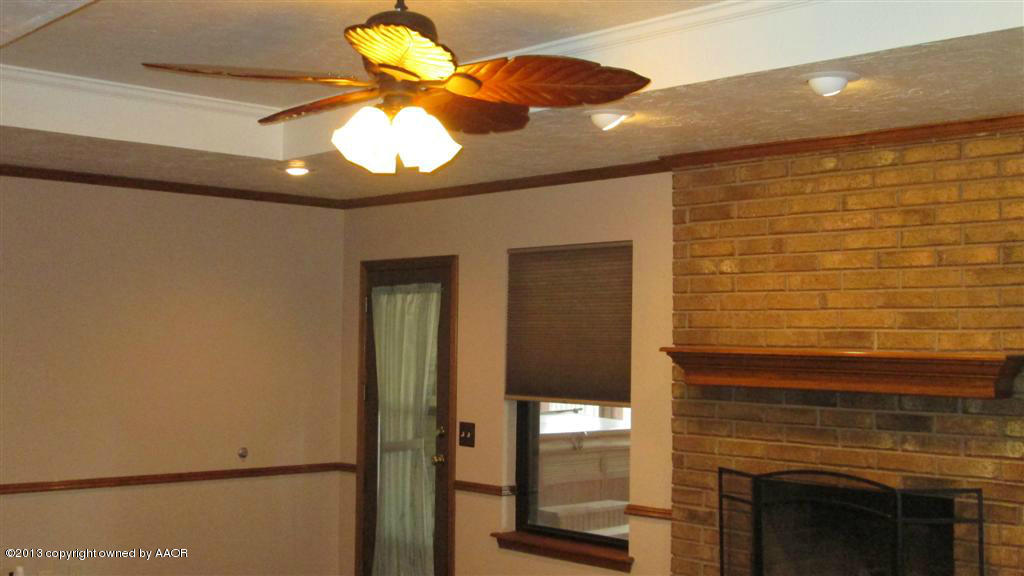 4211 Relatta Avenue Amarillo, TX 79110 - Photo 3 of 41 a view of chandelier fan and kitchen view