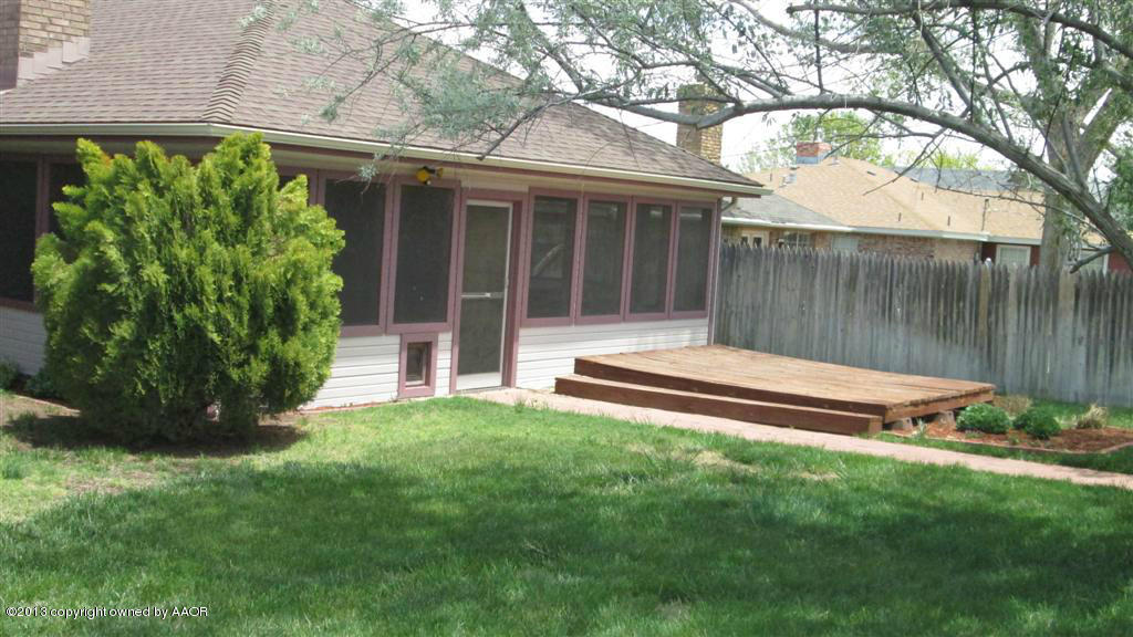 4211 Relatta Avenue Amarillo, TX 79110 - Photo 31 of 41 a view of a backyard with a garden and deck