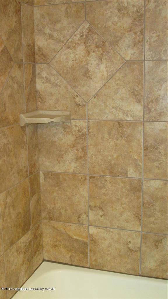 4211 Relatta Avenue Amarillo, TX 79110 - Photo 33 of 41 a bathroom with a shower