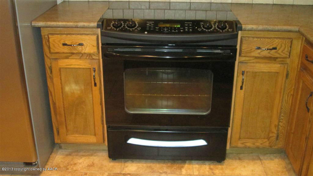 4211 Relatta Avenue Amarillo, TX 79110 - Photo 10 of 41 a close view of a stove