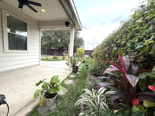 a view of a house with swimming pool and sitting area