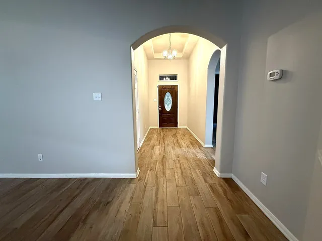 a view of a living room with wooden floor
