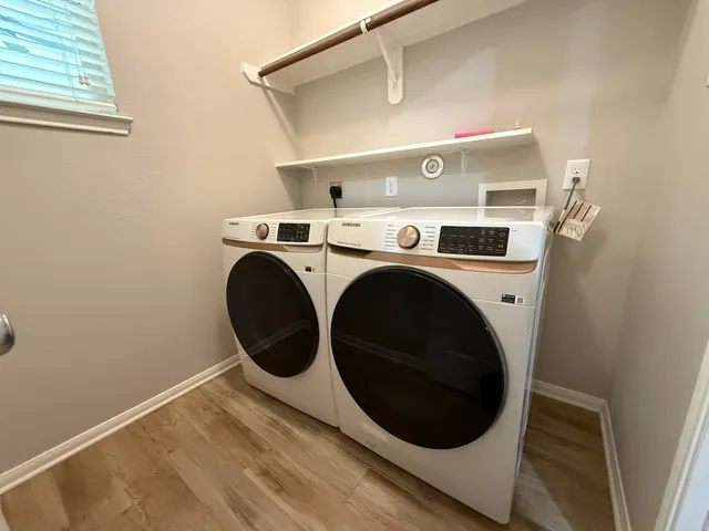 a utility room with dryer and washer