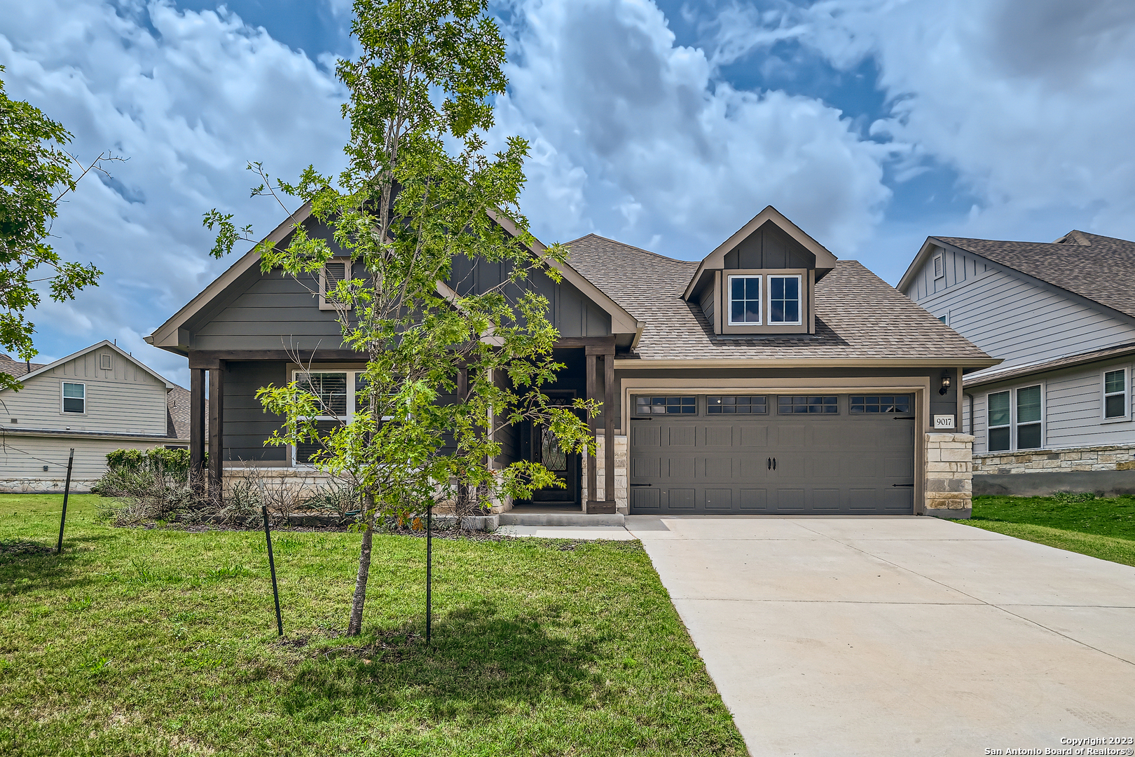 9017 Curling Post Schertz, TX 78154 - Photo 1 of 1 a front view of a house with a yard and green space