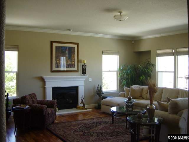 2928 Flint Ridge Court Reno, NV 89511 - Photo 2 of 5 a living room with furniture fireplace and window