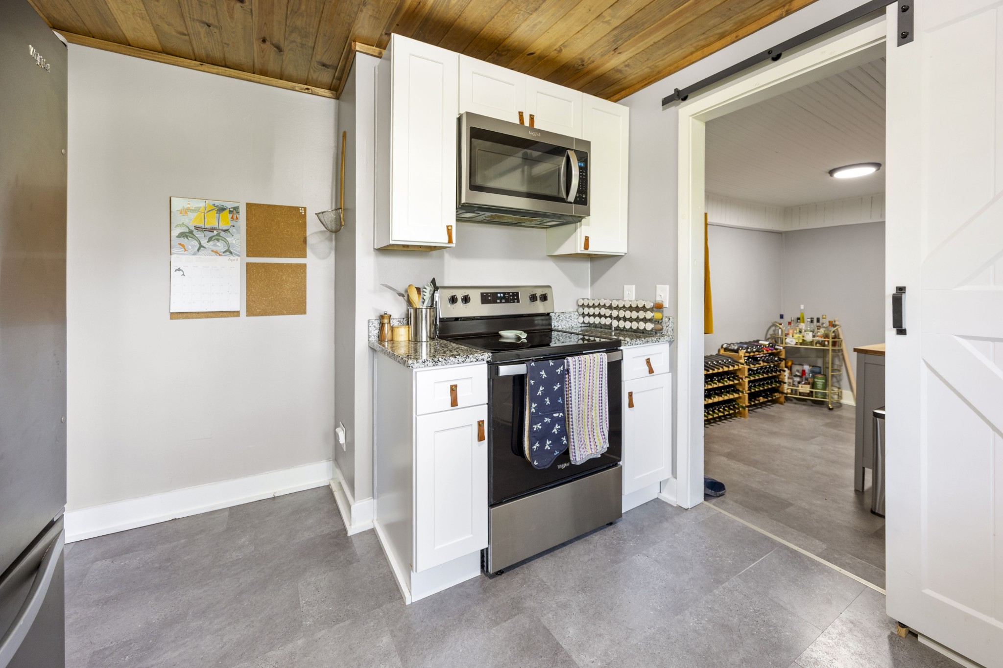 905 Nicholson Street Decherd, TN 37324 - Photo 11 of 27 a kitchen with stainless steel appliances granite countertop a stove and a refrigerator