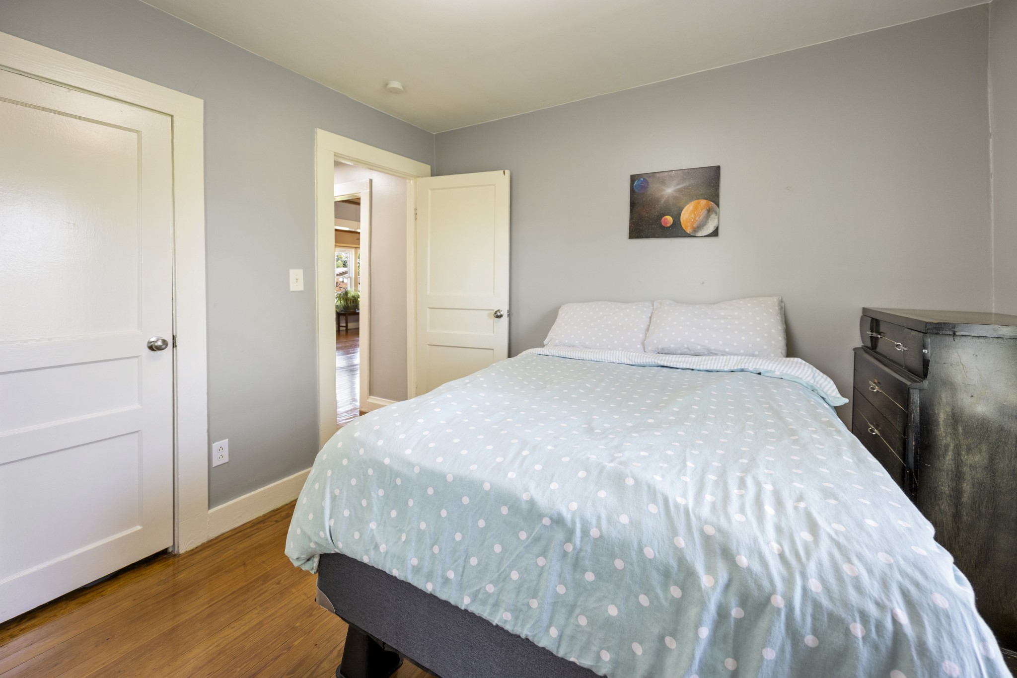 905 Nicholson Street Decherd, TN 37324 - Photo 14 of 27 a bedroom with a bed and wooden floor