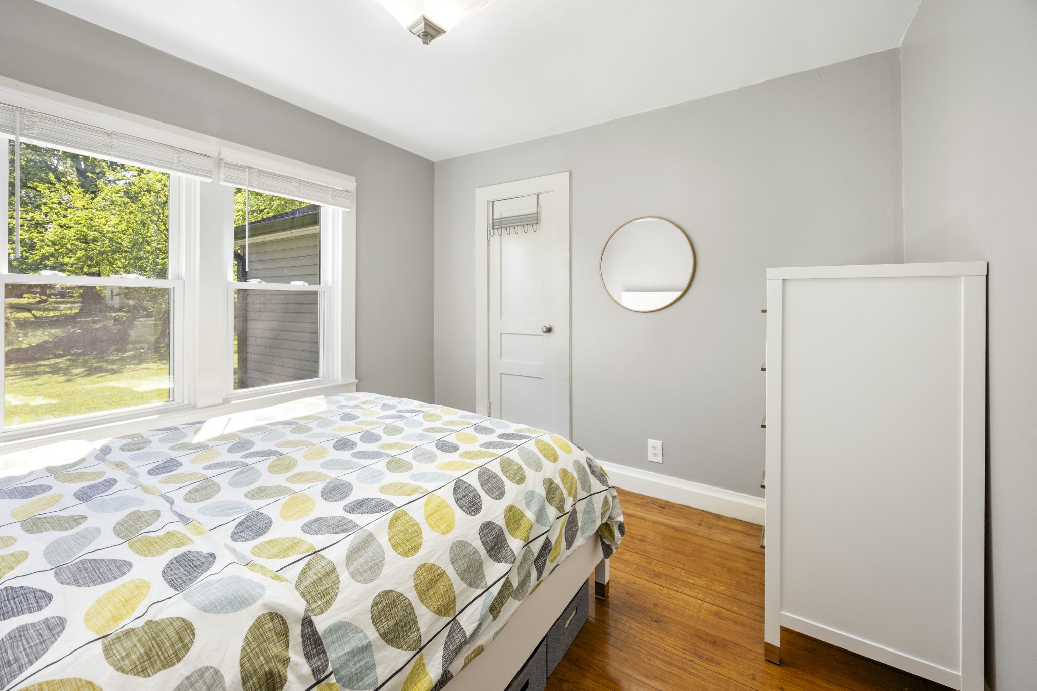 905 Nicholson Street Decherd, TN 37324 - Photo 16 of 27 a bedroom with a bed and wooden floor