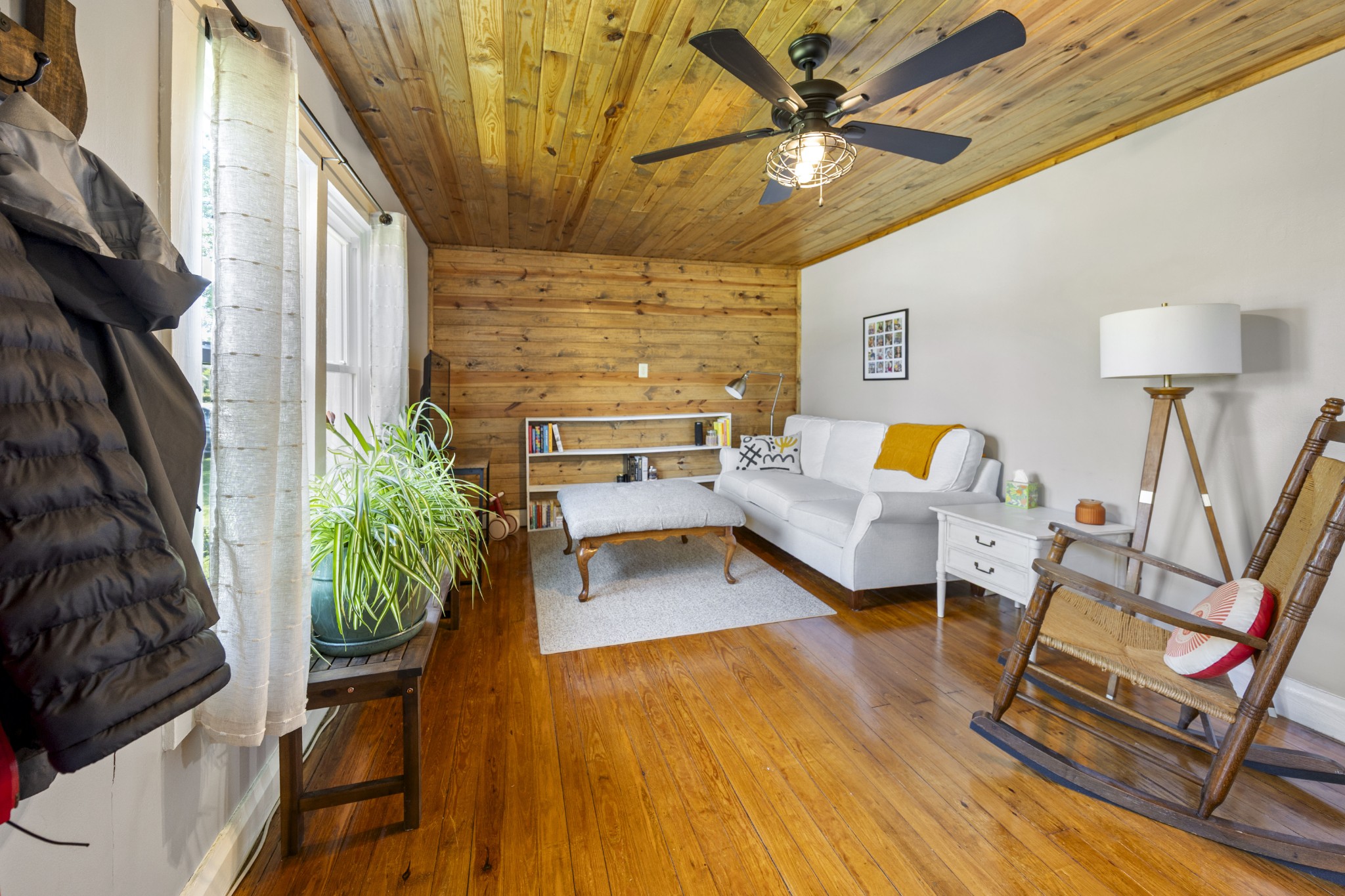 905 Nicholson Street Decherd, TN 37324 - Photo 4 of 27 a living room with patio furniture and a fireplace